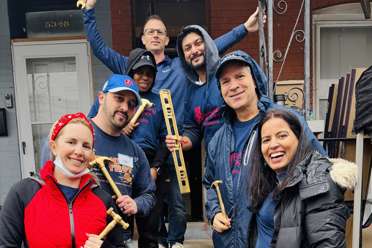 group of employee volunteers with tools